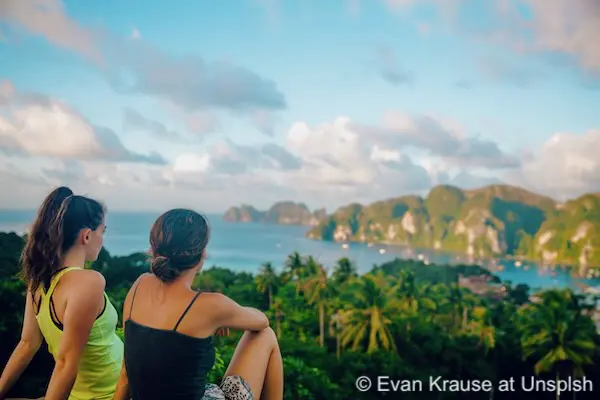 Two girls looking at the view from the Ko Phi Phi Islands viewpoint in Krabi, Thailand.