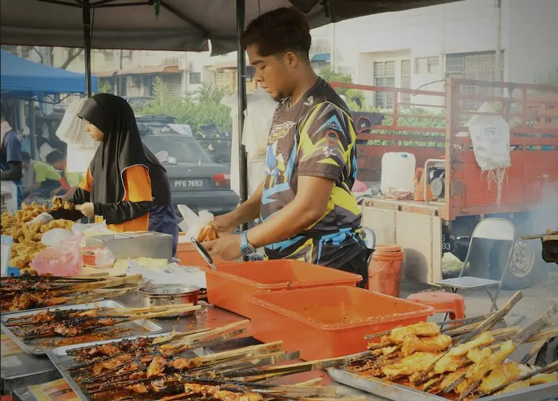Thais cooking street food in Krabi.
