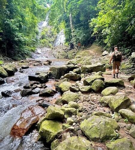 Walking to the Huay To Waterfall along the stream.