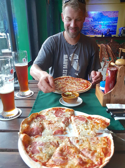 Eating pizza and drinking fine German beer at Bistro Monaco's restaurant in Krabi Town.